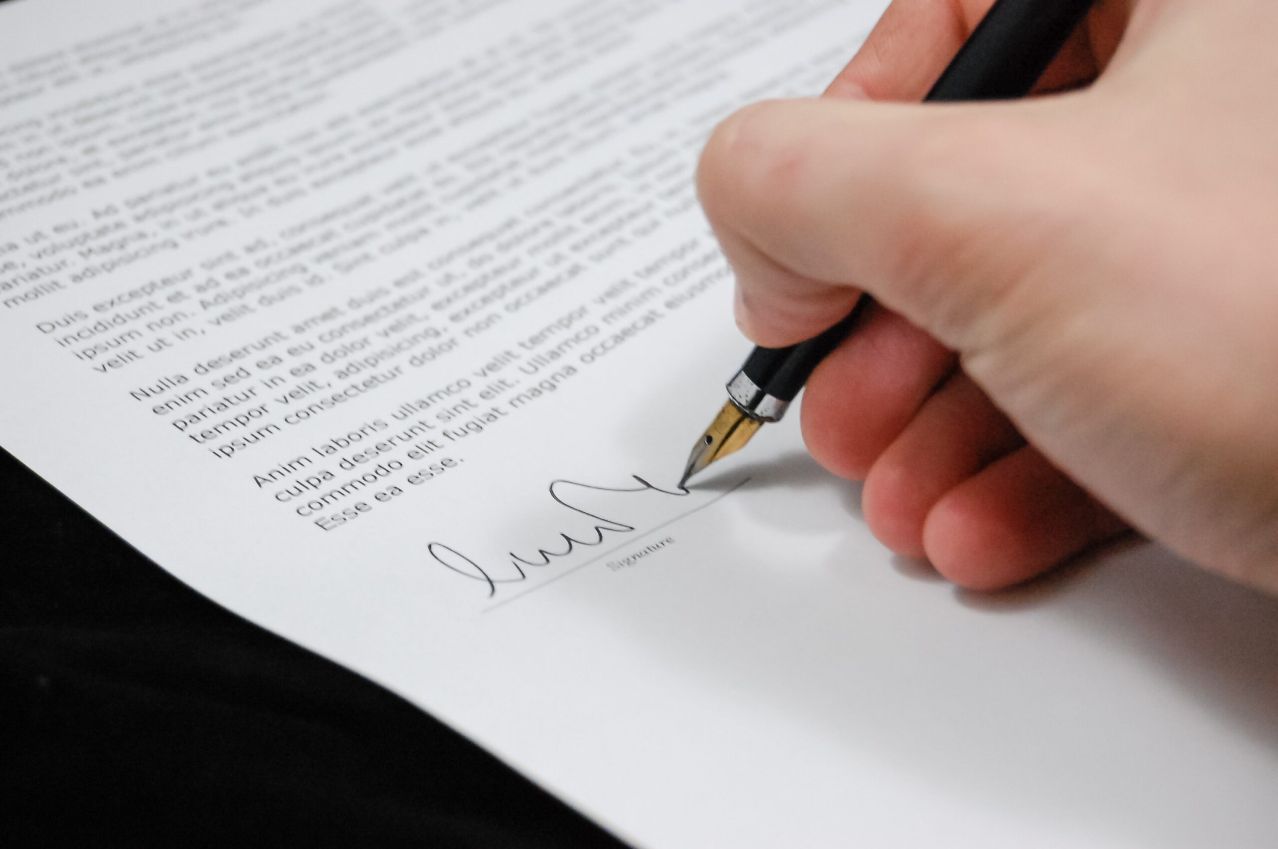 male hand with pen on paper